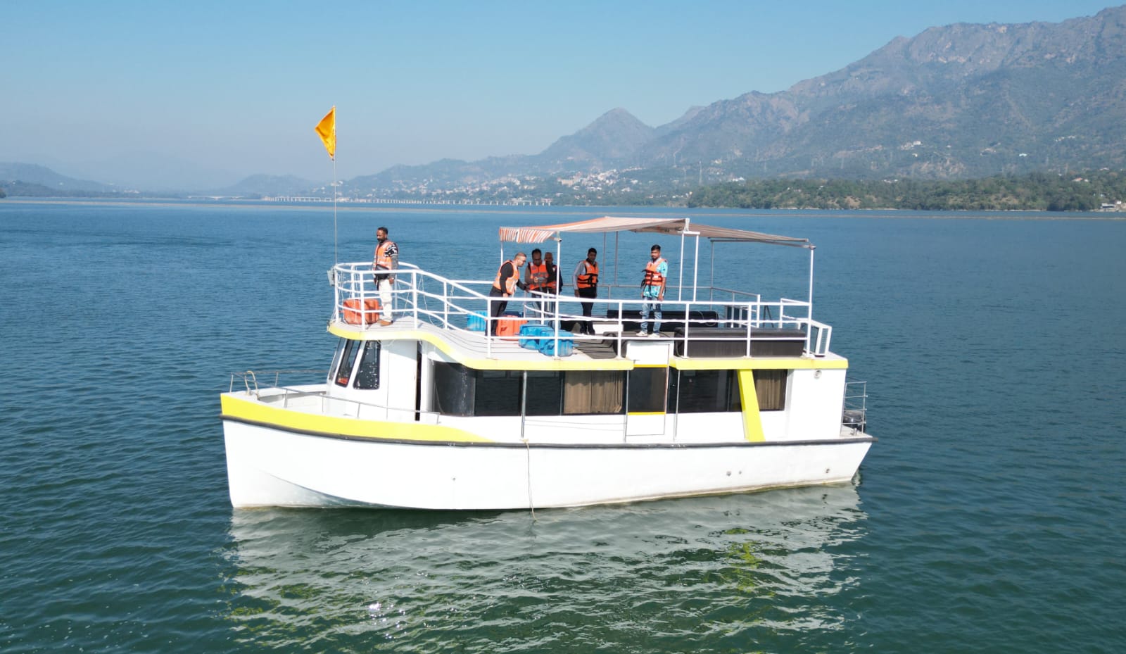 Himalayan Adventure luxury cruise with the hills of Bilaspur behind it